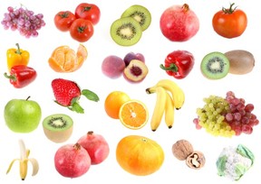 A selection of fruits, nuts and vegetables on a white background.