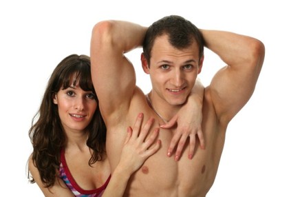 A muscular couple posing.