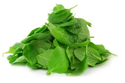 A pile of spinach on a white background.