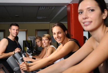 A group of women in an exercise bike class.