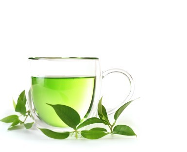 A glass cup of green tea.
