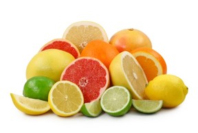 A selection of chopped and whole citrus fruits.