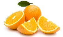 A whole and chopped orange on a white background.