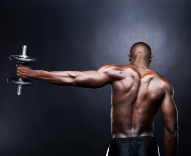 A man doing a dumbbell lateral raise.