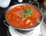 A large pot of beef and chilli soup.