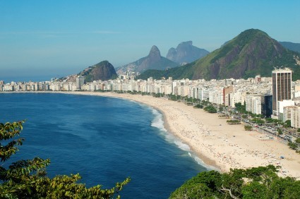 A photo of Copacabana beach and the surrounding city.