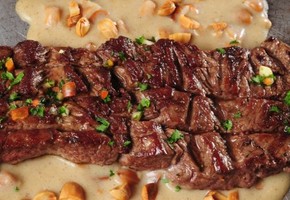A beef fillet steak in almond sauce.