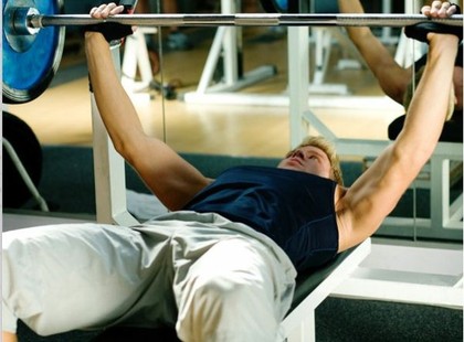 A man performing the bench press.