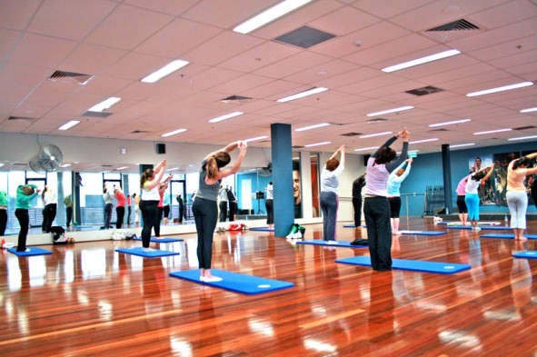 People exercising in a yoga class.