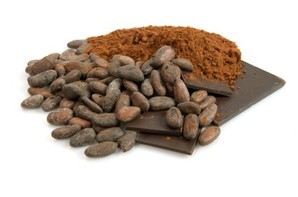 A selection of whole and ground cocoa beans.