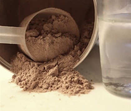 A close up shot of chocolate whey protein.