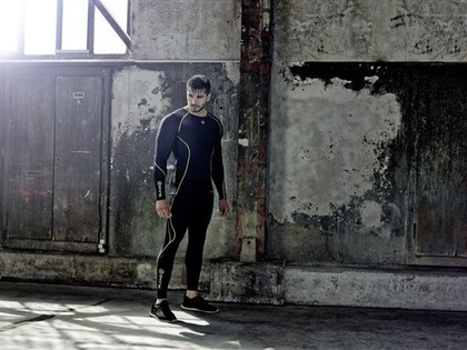 A man wearing SKINS technology.