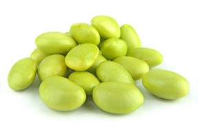 A close up of some green soybeans.