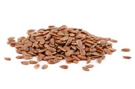 A pile of flaxseeds on a white background.