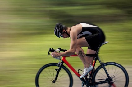 A competitive cyclist on a country road.