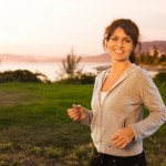 A happy woman walking outdoors.