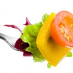 A portion of salad on a fork.