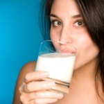 A woman drinking milk.