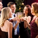A group of people enjoying a Christmas party.