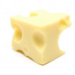 A block of swiss cheese on a white background.