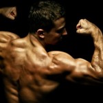 A bodybuilder flexing his arms and back.