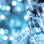 A blue tinted bottle of champagne that reads "Happy New Year".