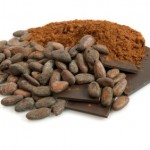 A selection of whole and ground cocoa beans.