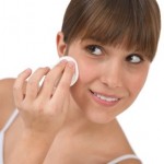 A woman wiping her face.