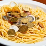 A plate of spaghetti and money.
