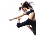 A female dancer jumping in the air.