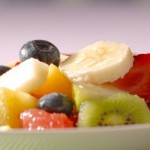 A close up shot of a bowl of fruit salad.