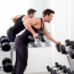 A man performing dumbbell bent over rows.