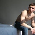A frustrated man sitting on the bed.